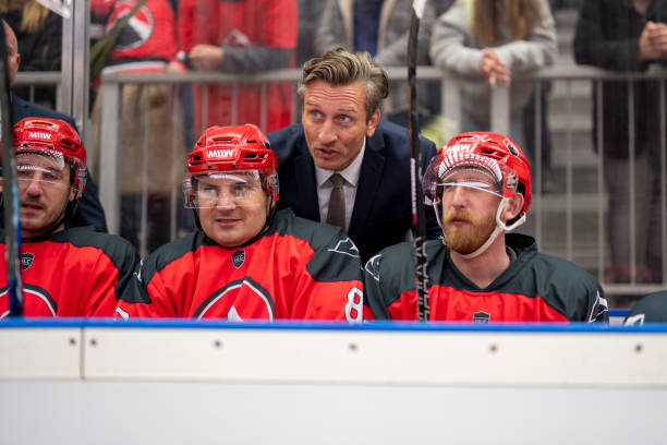 istock Intense Discussion Between Coach and Players on the Bench 2168983217