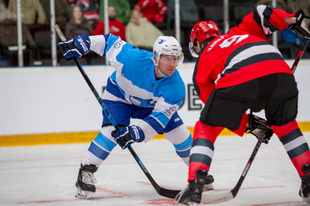 istock Face-Off Battle During Intense Ice Hockey Match 2168983257