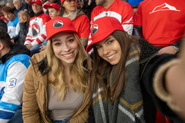 istock Friends Enjoying a Hockey Game 2168983715