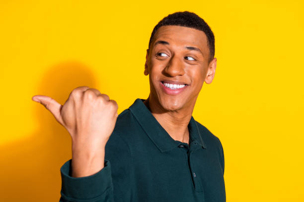istock Portrait of nice young man indicate finger empty space wear pullover isolated on vibrant yellow color background 2168983864