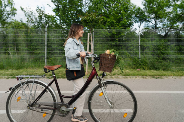 Photo of a young woman who went groceries shopping on her bicycle