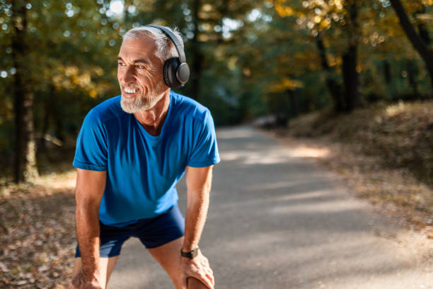 istock Active Senior Man Takes a Break with Headphones 2168988897
