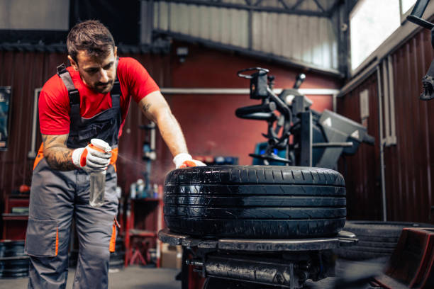 istock Locating puncture on damaged tire. 2168995316