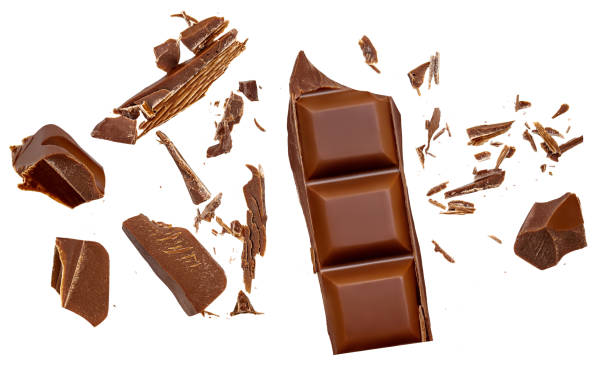istock Chocolate explosion isolated on white. Flying milk Chocolate pieces. Chocolate flakes and  chips Top view. Flat lay. 2168997219