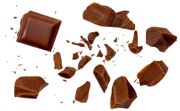 istock  Levitating dark chocolate chunks isolated on white background. Broken chocolate bar pieces and cocoa crumbs explotion. Chocolate flakes and  chips Top view. Flat lay. 2168997401