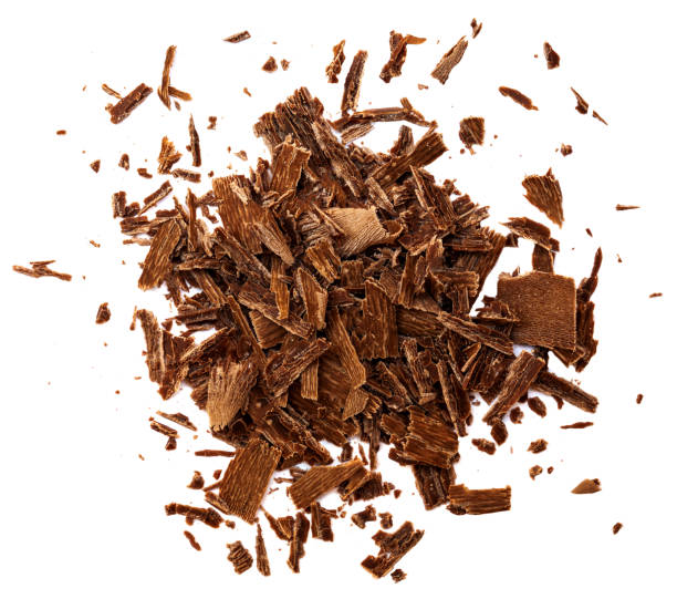 Grated Chocolate Isolated. Dark Chocolate Sprinkles or chips on white background. Scattered cocoa  Flakes top view. Flat lay