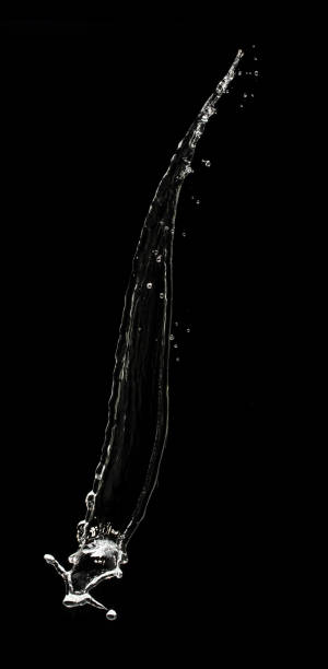 istock Throwing water to object make curve drop splash in explosion motion. Black background isolated. Throwing Splatter Water splash hit on object to create shape form fluttering in droplet and wave 2168997954
