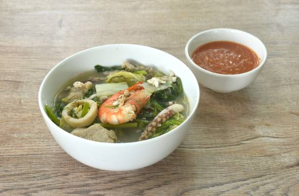 boiled sukiyaki seafood chicken and pork meat couple crispy pickled squid and shrimp with vegetable in soup dipping sauce