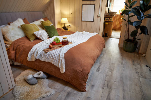 istock Modern bedroom interior, double bed with beige linen bedspread and colorful pillows 2169009699