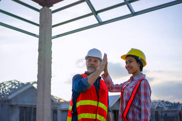istock Blue collar workers are building house. 2169011872
