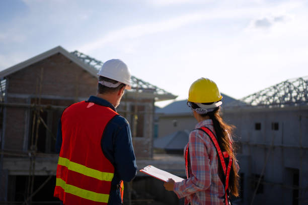 istock Blue collar workers are building house. 2169011987