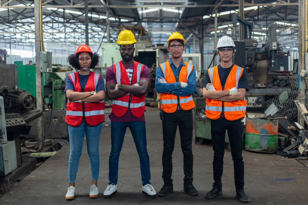 istock Group of various engineer professional successful team corporate workers standing in factory. teamwork technician inspector manufacturing industry workplace. Full team industrial factory concept. 2169012224