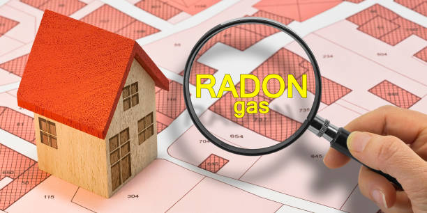istock RADON GAS TESTING - Concept with magnifying glass and home model 2169020703