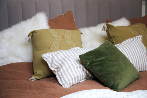 istock Decor of a double bed with colorful pillows in modern style 2169020865