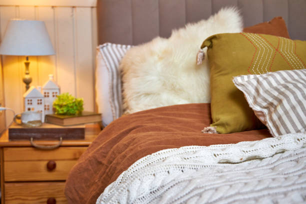 istock Decor of a double bed with colorful pillows in modern style 2169021272