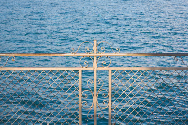 Metal railing to protect against falling into water - security concept