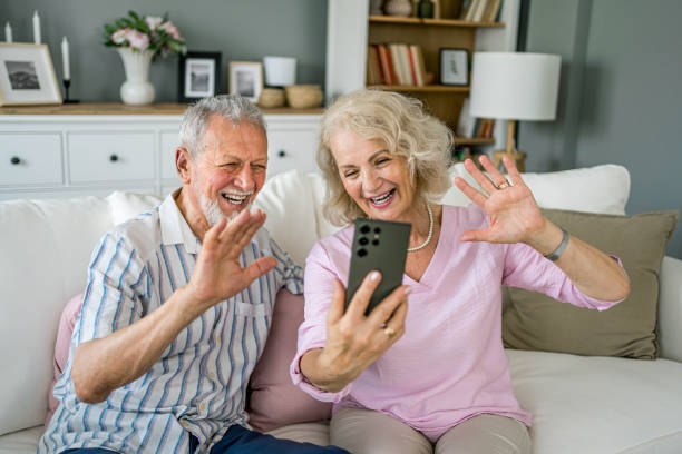 istock Senior couple having a video call at home 2169029879