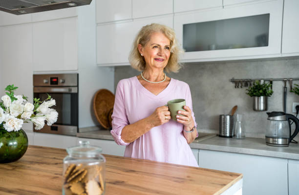 istock Senior woman drinking first morning coffee 2169030871