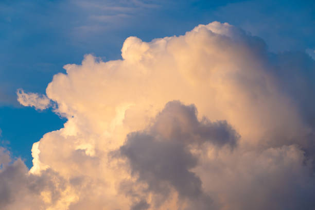 Beautiful cloudy landscape at sunset. Sky background. Blue sky and cumulus clouds.