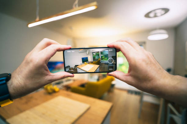 istock Virtual tour. Hands holding smartphone taking pictures 2169035727