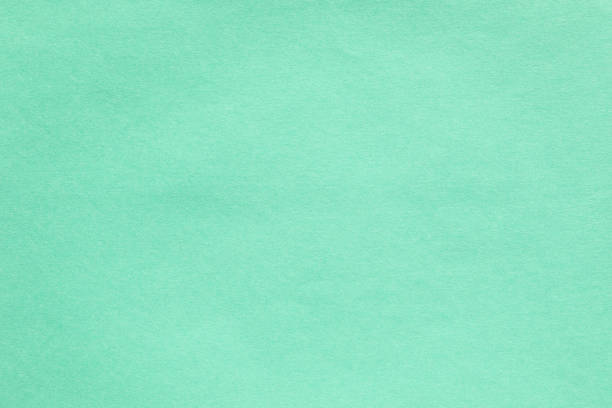 istock Macro closeup of kraft light green paper texture 2169036472