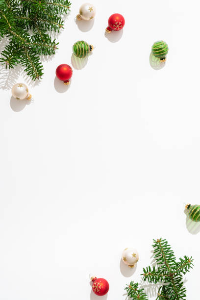 istock Christmas composition. Christmas red and green balls decorations on white background. Flat lay, top view, copy space. New year greeting card, placard background. 2169042630
