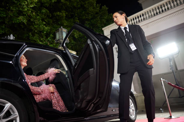 Bodyguard opening door for celebrity at event