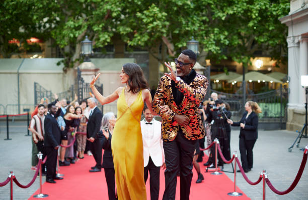 istock Celebrities waving at fans during premier event 2169043107