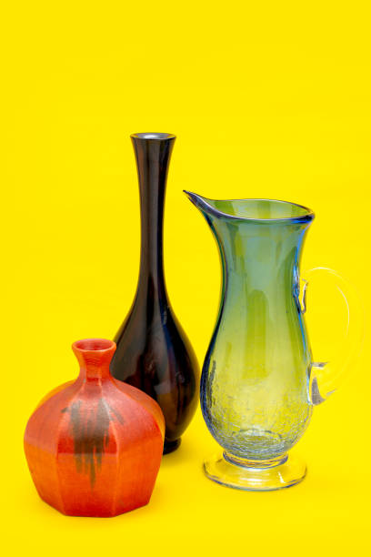 istock set black, red antique ceramic vase. decorative ceramic pot on yellow background. brown modern porcelain vase for room interior. vintage handmade glaze pottery flowerpot office decoration collection 2169043135