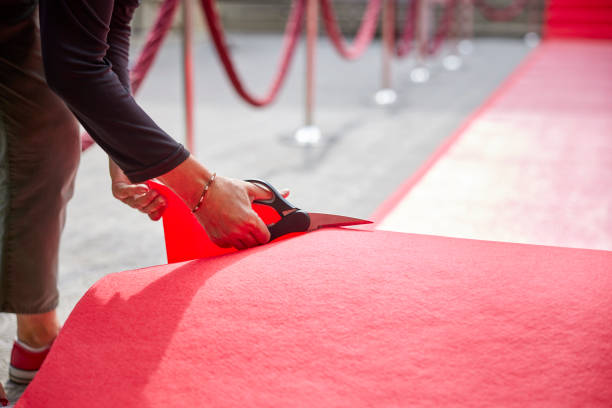 istock Woman cutting red carpet for event 2169043258