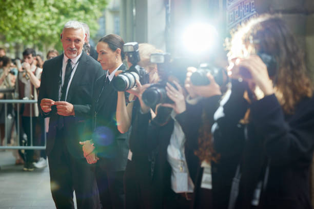 istock Bodyguards standing near paparazzi at event 2169043683