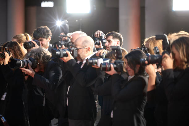 istock Paparazzi taking photos at event 2169043789