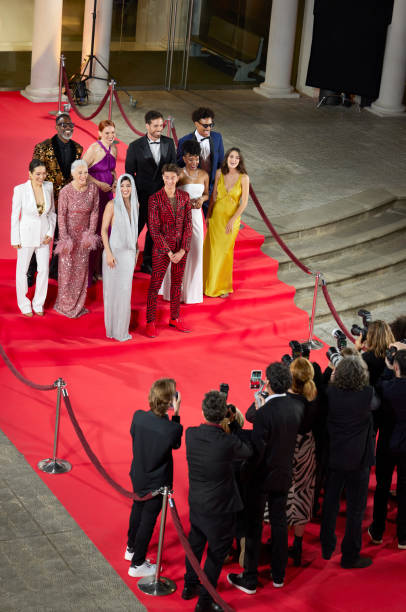 istock Celebrities posing for paparazzi on red carpet 2169043953