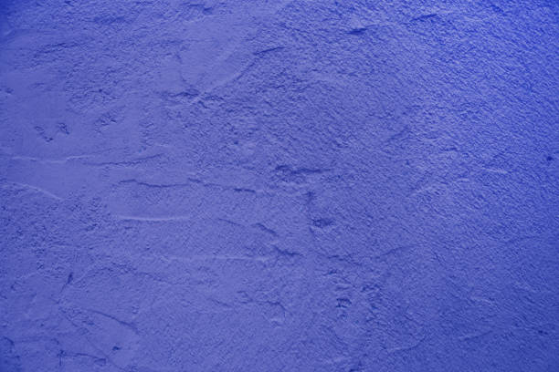 Abstract background for design from plaster closeup. Background made of relief  blue plaster.