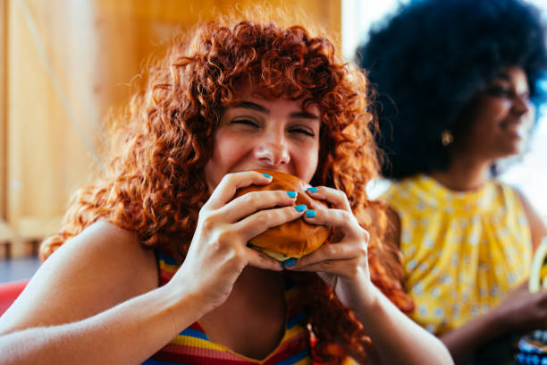 istock Multiethnic group of friends having meal at diner restaurant 2169048963