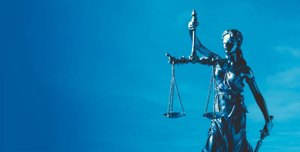 istock Lady justice. Statue of Justice on sky background 2169054125