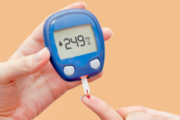 istock Doctor making blood sugar test in clinic 2169054190