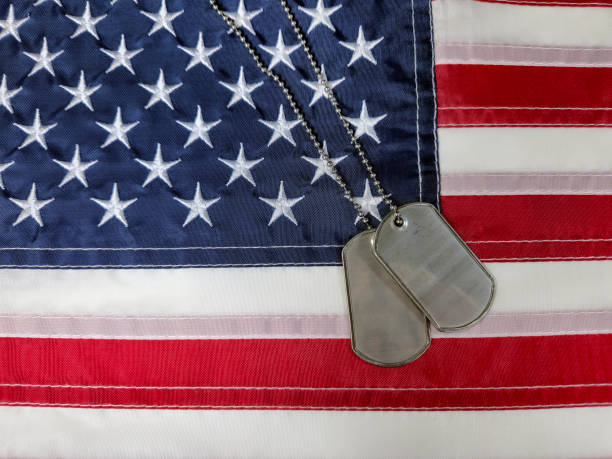 istock Military Dog Tags On American Flag 2169060122
