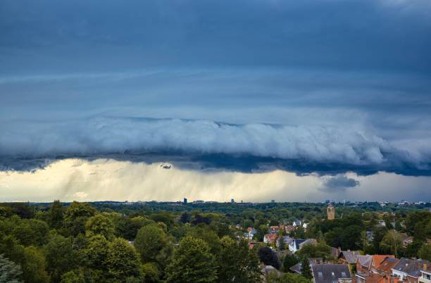 istock Dark menacing thunder cloudscape over a suburb with rain and storm 2169063326