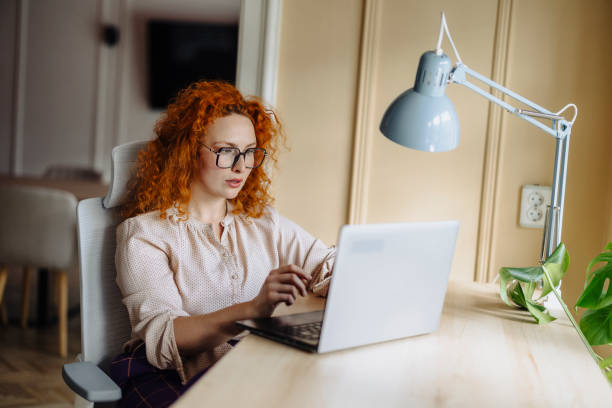 istock Businesswoman using laptop and working at office 2169064958