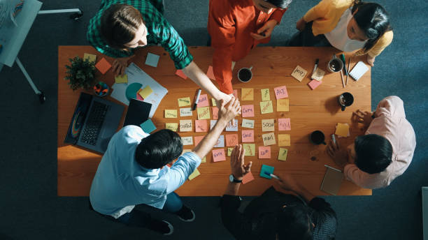 istock Top view of business team putting hand together and clapping hand. Convocation. 2169065843