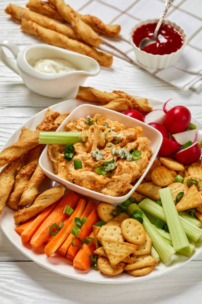 istock buffalo chicken dip with veggie and bread sticks 2169067839