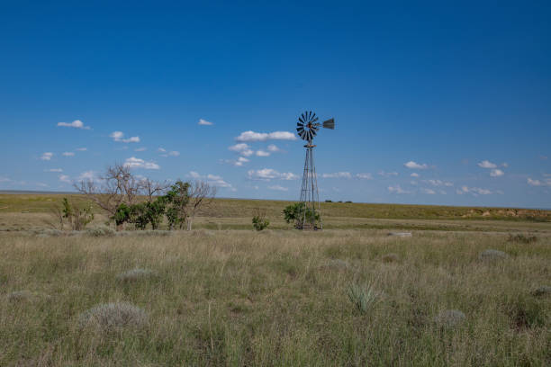 istock Old windmill with clouds on the eastern Colorado prairie 2169069995