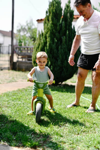 istock Fun For Toddler And Grandpa With Beginner Bicycle Riding Lessons 2169071286