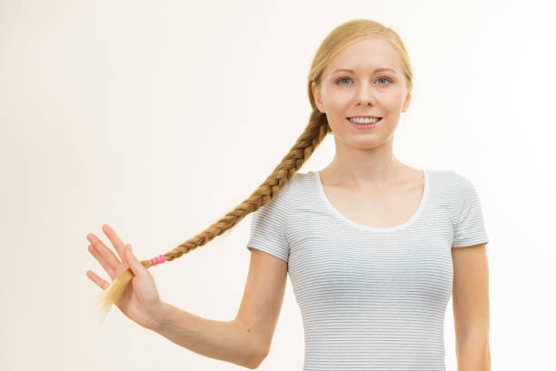 istock Blonde young woman with braid hair 2169072711