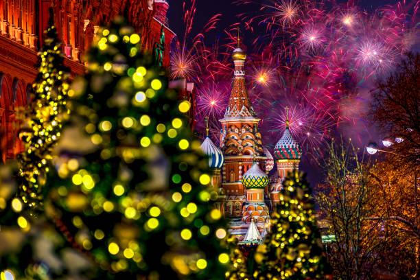 istock St. Basil's Cathedral with festive fireworks and decorated fir trees. Blurred scenery in the foreground, against the background of the night sky. Festive fireworks. Moscow, Russia 2169074204