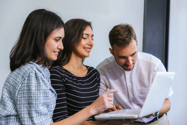 istock Businessmans crew working with new startup project in modern Office. Group of diverse businesspeople working together around a meeting table in an office 2169085951
