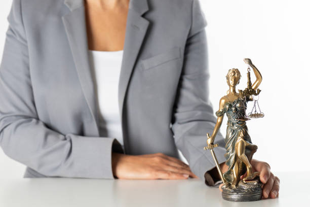 Themis statue isolated on white background. Lady justice.