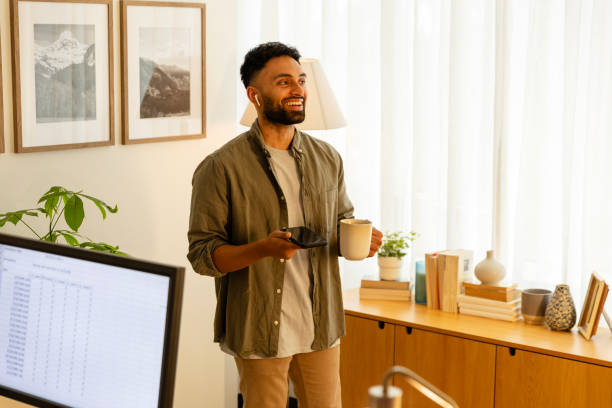 istock Working from home, man has quick meeting using smart phone 2169088370