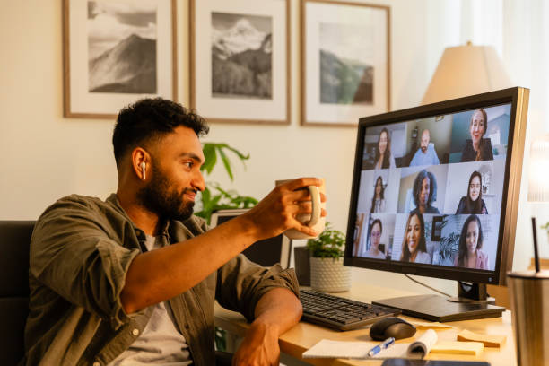 istock Entrepreneur raises coffee in toast to virtual team 2169088371